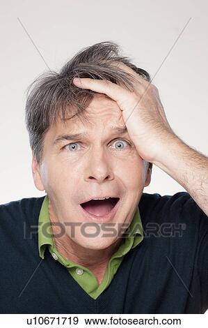 Stock Photo - Studio portrait of mature man with facial expression. Fotosearch