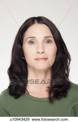 Studio portrait of mature woman View Large Photo Image Stock Photo - Studio portrait of mature woman. Fotosearch