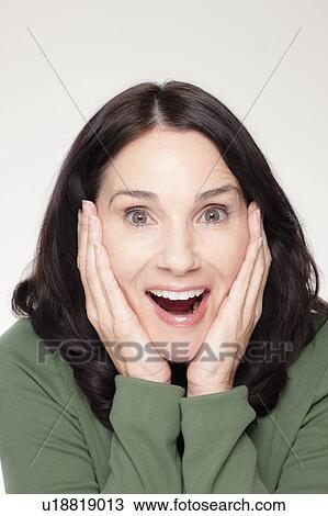 Studio portrait of mature woman with head in hands View Large Photo Image Stock Image - Studio portrait of mature woman with head in hands. Fotosearch