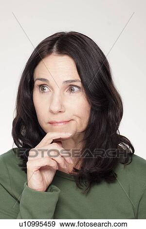 Studio portrait of mature woman with facial expression View Large Photo Image Stock Photo - Studio portrait of mature woman with facial expression. Fotosearch