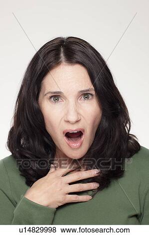 Studio portrait of mature woman with facial expression View Large Photo Image Stock Photo - Studio portrait of mature woman with facial expression. Fotosearch