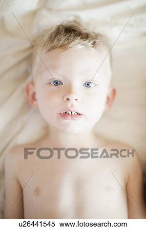 Studio portrait of shitless toddler boy (2-3) View Large Photo Image Stock Photography - Studio portrait of shitless toddler boy (2-3). Fotosearch