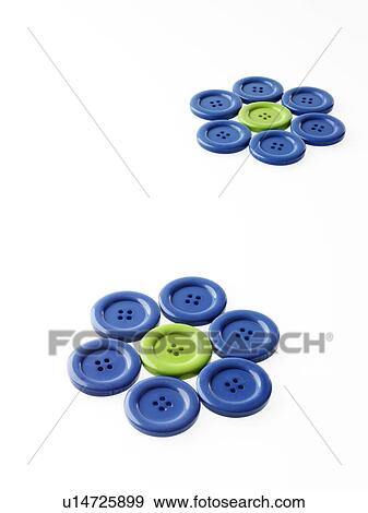 Stock Photo - Studio shot of blue and green buttons arranged in flower head. Fotosearch