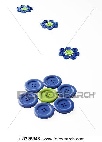 Stock Photograph - Studio shot of blue and green buttons arranged in flower head. Fotosearch
