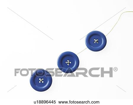 Stock Photography - Studio shot of blue buttons in a row. Fotosearch