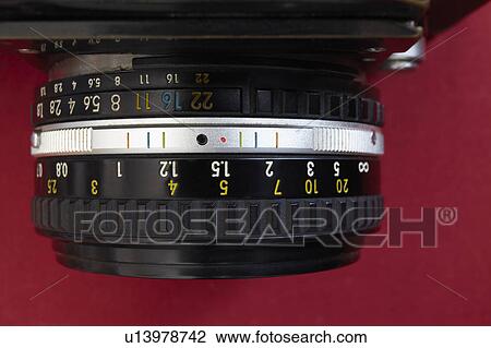 Stock Image - Studio shot of camera's lens. Fotosearch