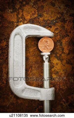 Stock Photography - Studio shot of coin in vise grip. Fotosearch