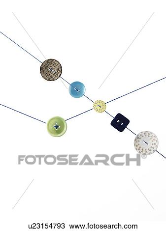 Stock Image - Studio shot of diagram made of thread and buttons. Fotosearch