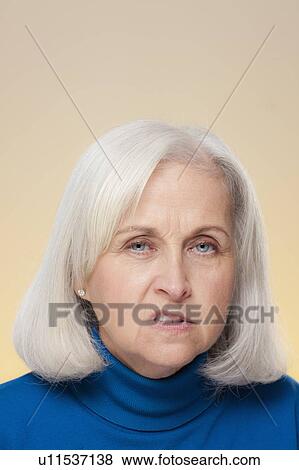 Stock Photo - Studio shot of displeased senior woman. Fotosearch
