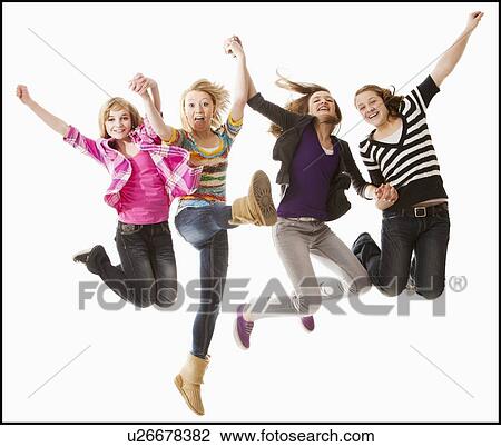 Stock Image - Studio shot of four happy girls (12-13). Fotosearch