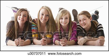 Studio shot of four happy girls (12-13) View Large Photo Image Stock Image - Studio shot of four happy girls (12-13). Fotosearch
