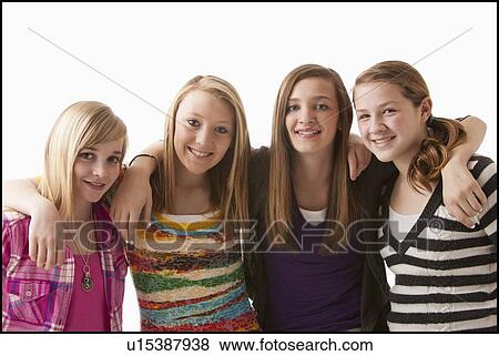 Studio shot of four happy girls (12-13) View Large Photo Image Stock Photo - Studio shot of four happy girls (12-13). Fotosearch