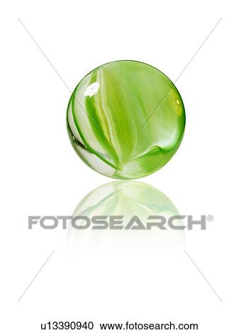Stock Image - Studio shot of green marbles arranged in Exclamation Point. Fotosearch