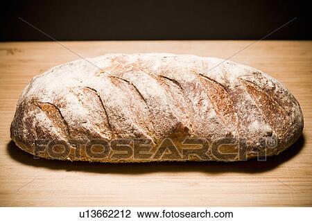 Studio shot of loaf of bread View Large Photo Image Stock Image - Studio shot of loaf of bread. Fotosearch
