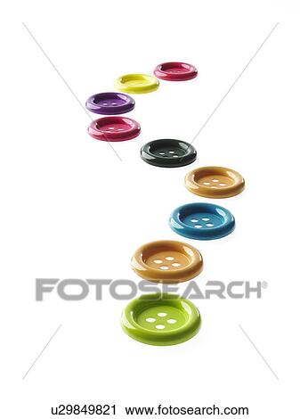 Stock Image - Studio shot of medium group of multi colored buttons. Fotosearch