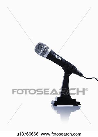 Stock Photograph - Studio shot of microphone on white background. Fotosearch