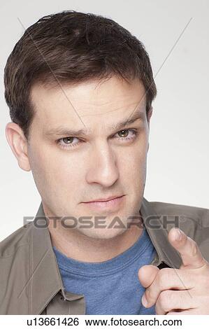 Studio shot of mid adult man View Large Photo Image Stock Photograph - Studio shot of mid adult man. Fotosearch