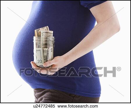 Studio Shot of mid section of pregnant woman holing jar with money View Large Photo Image Stock Photography - Studio Shot of mid section of pregnant woman holing jar with money. Fotosearch