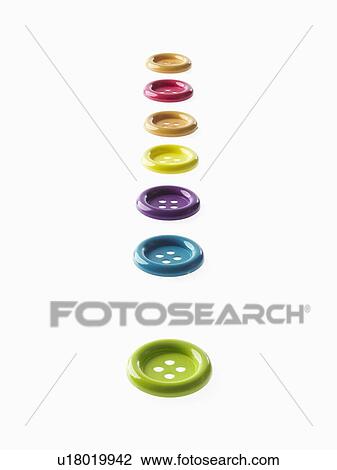 Stock Image - Studio shot of multi colored buttons in a row. Fotosearch