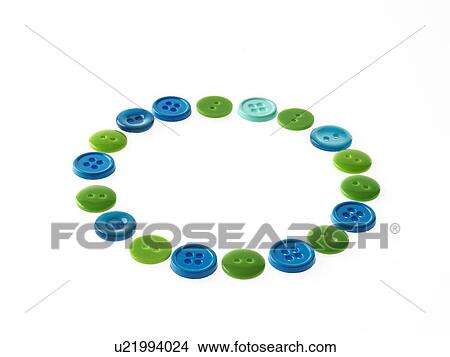 Picture - Studio shot of multi colored buttons arranged in circle. Fotosearch