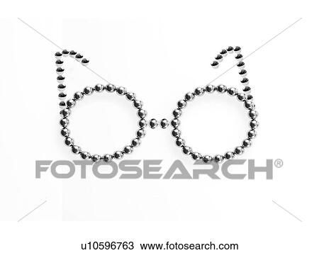 Stock Image - Studio shot of Pachinko balls arranged in glasses. Fotosearch