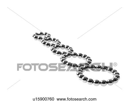 Stock Image - Studio shot of Pachinko balls arranged in single row of circles. Fotosearch
