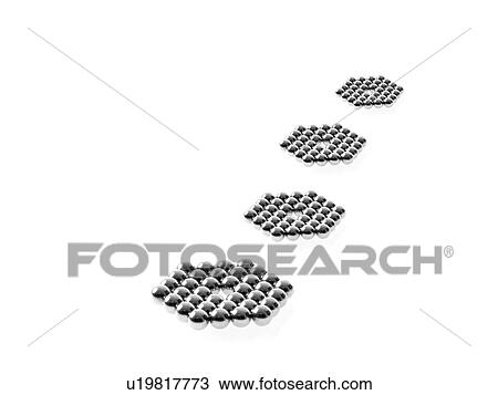 Stock Image - Studio shot of Pachinko balls arranged in single row of hexagons. Fotosearch