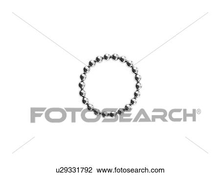Stock Image - Studio shot of Pachinko balls arranged in circle. Fotosearch