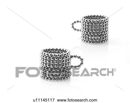 Stock Photo - Studio shot of Pachinko balls arranged in mug. Fotosearch