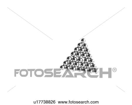 Stock Photograph - Studio shot of Pachinko balls arranged in triangle. Fotosearch