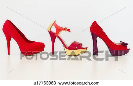 Stock Image - Studio shot of red high heel shoes. Fotosearch