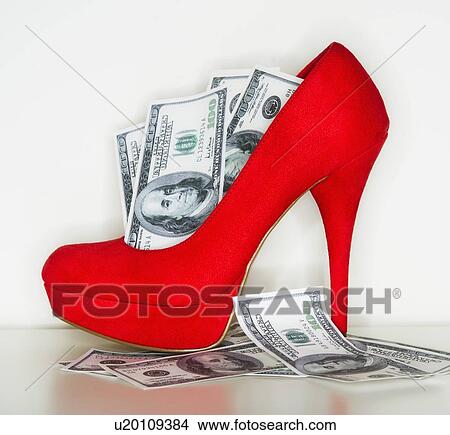 Studio shot of red stiletto and dollar bills View Large Photo Image Picture - Studio shot of red stiletto and dollar bills. Fotosearch