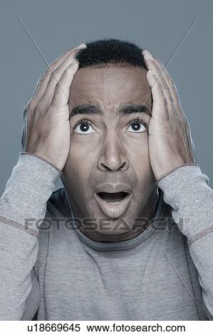 Studio shot of shocked man View Large Photo Image Stock Photography - Studio shot of shocked man. Fotosearch