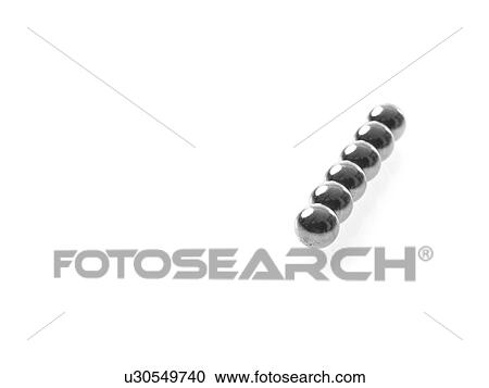 Stock Image - Studio shot of single row of Pachinko balls. Fotosearch
