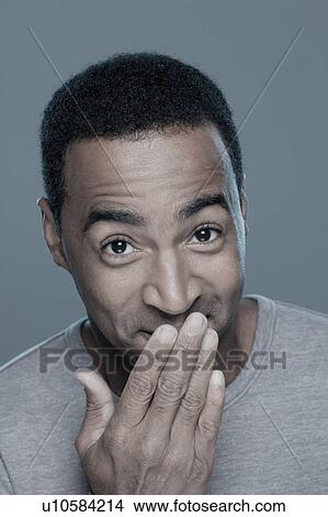 Studio shot of smiling man View Large Photo Image Picture - Studio shot of smiling man. Fotosearch