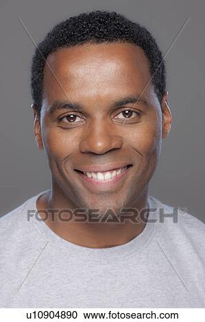 Studio shot of smiling mid adult man View Large Photo Image Stock Image - Studio shot of smiling mid adult man. Fotosearch