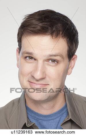 Studio shot of smiling mid adult man View Large Photo Image Stock Image - Studio shot of smiling mid adult man. Fotosearch
