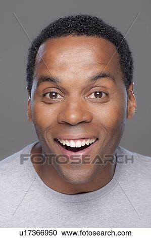 Studio shot of smiling mid adult man View Large Photo Image Stock Image - Studio shot of smiling mid adult man. Fotosearch