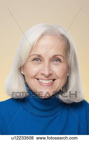 Studio shot of smiling senior woman View Large Photo Image Stock Photo - Studio shot of smiling senior woman. Fotosearch