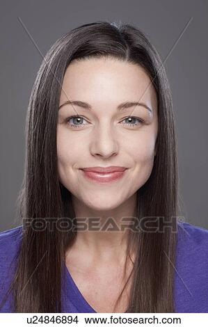 Studio shot of smiling young woman View Large Photo Image Picture - Studio shot of smiling young woman. Fotosearch