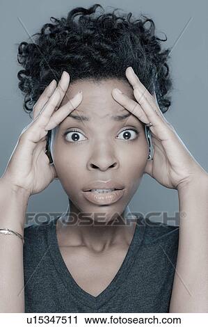 Studio shot of surprised young woman View Large Photo Image Stock Image - Studio shot of surprised young woman. Fotosearch
