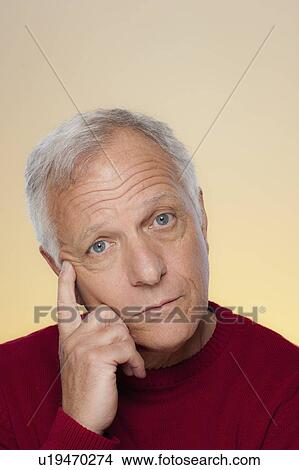 Picture - Studio shot of thoughtful senior man. Fotosearch