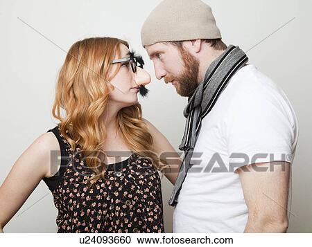 Studio Shot of three people dressed up in animal noses and sombrero View Large Photo Image Stock Image - Studio Shot of three people dressed up in animal noses and sombrero. Fotosearch