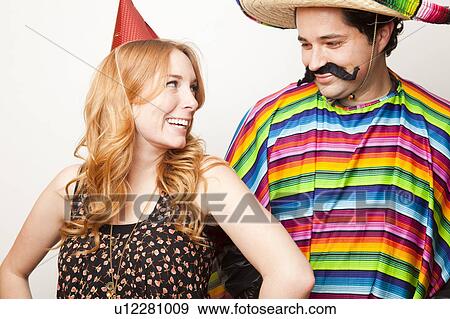 Studio Shot of two people dressed up View Large Photo Image Stock Photo - Studio Shot of two people dressed up. Fotosearch