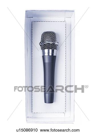 Stock Image - Studio shot of unplugged microphone still in box. Fotosearch