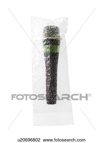 Studio shot of unplugged microphone still in bubble bag View Large Photo Image Stock Image - Studio shot of unplugged microphone still in bubble bag. Fotosearch