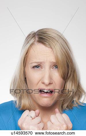 Studio shot of upset mid adult woman View Large Photo Image Stock Image - Studio shot of upset mid adult woman. Fotosearch