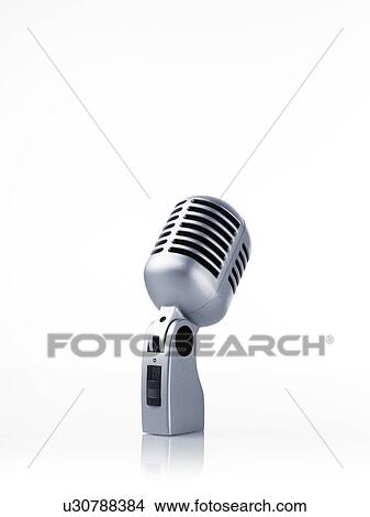 Studio shot of vintage-themed modern microphone on white background View Large Photo Image Picture - Studio shot of vintage-themed modern microphone on white background. Fotosearch