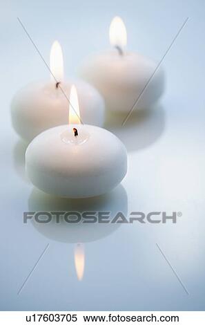 Studio shot of white candles View Large Photo Image Stock Photography - Studio shot of white candles. Fotosearch