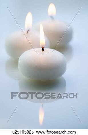 Studio shot of white candles View Large Photo Image Stock Photography - Studio shot of white candles. Fotosearch